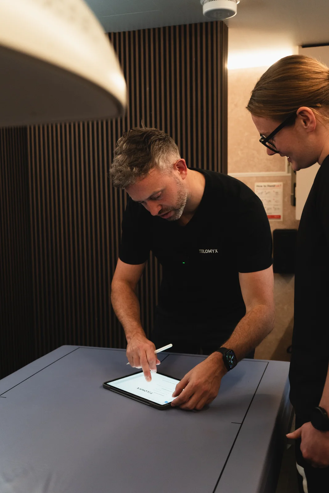 A TELOMYX specialist registering a client on the iPad