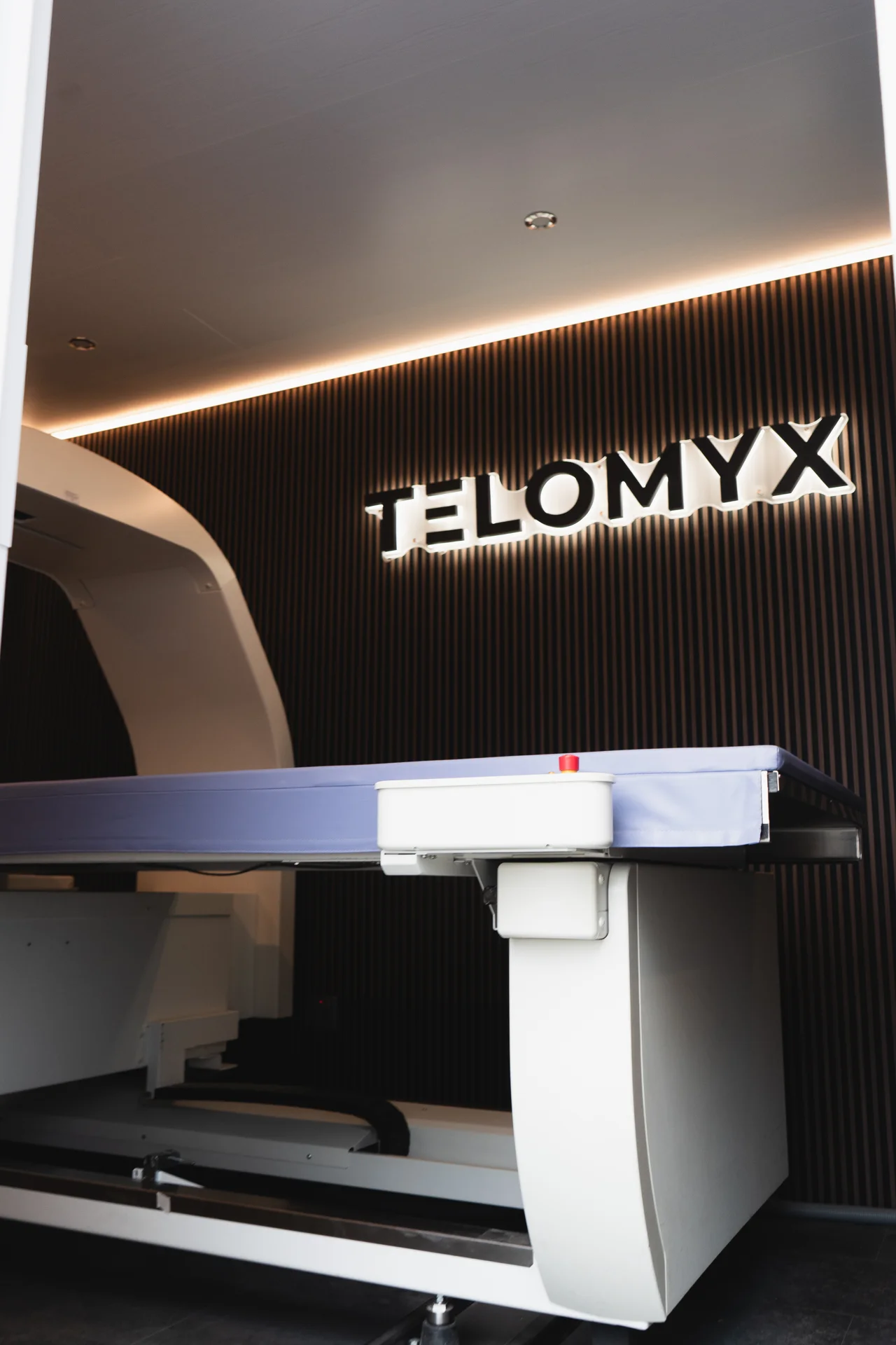 The DEXA scanner and illuminated TELOMYX sign inside the mobile clinic