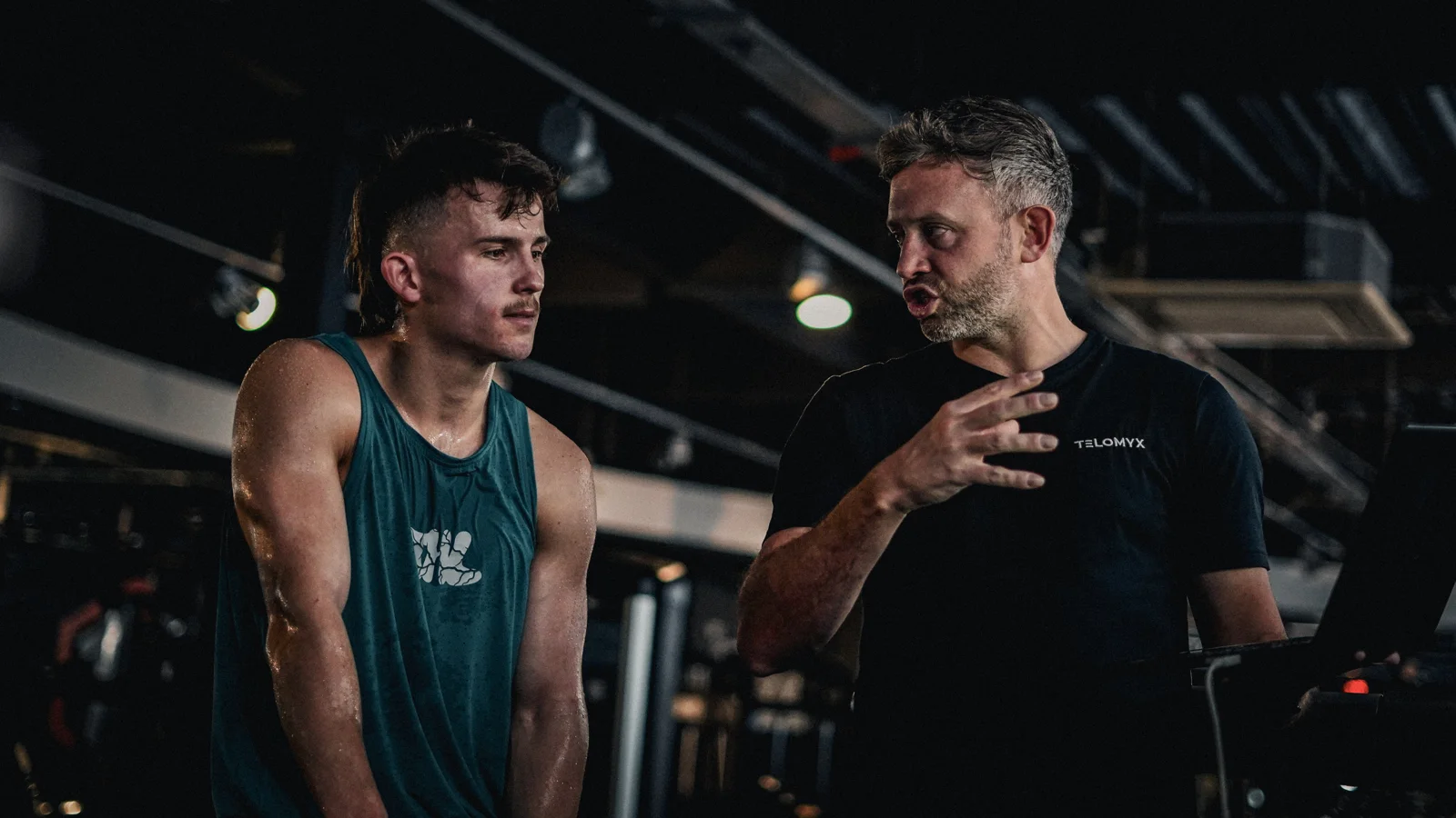 A TELOMYX specialist talking a client through their results at TransFit