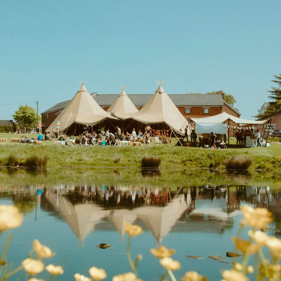The Farm Club tents beside the lake at Mere View Farm, Pickmere